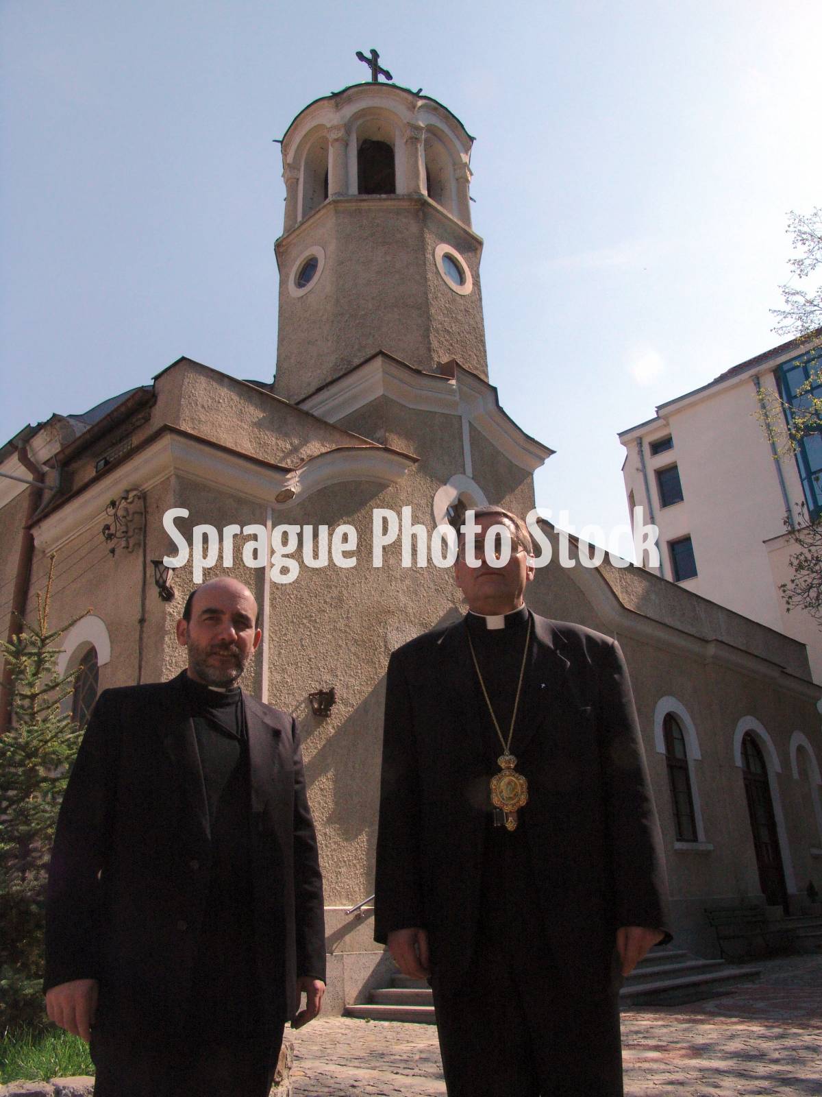 Bishop Christo Proykov (right) standing with Father Blagovast, standing in front of the Assumption church, Sofia. They are Byzantine Catholics. Bulgaria.